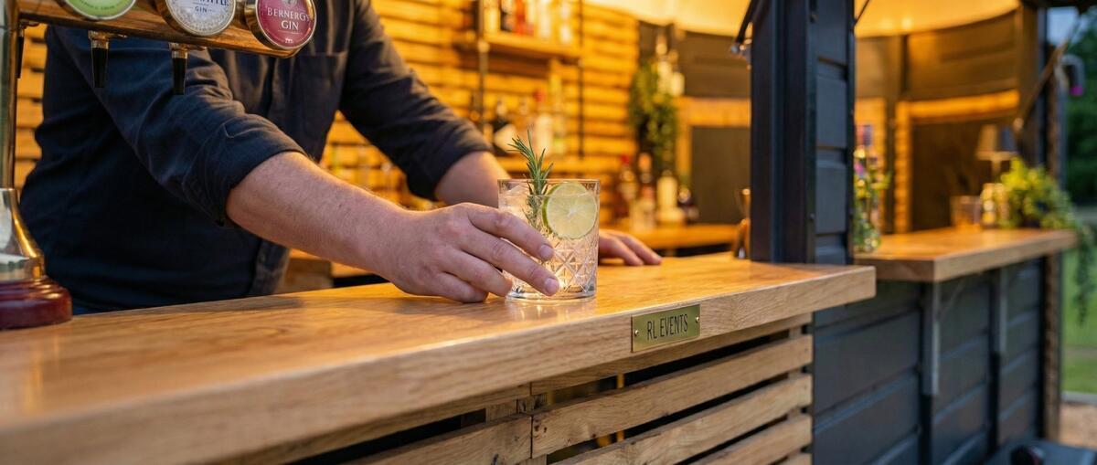 Horse box bar serving hatch in use at an outdoor event
