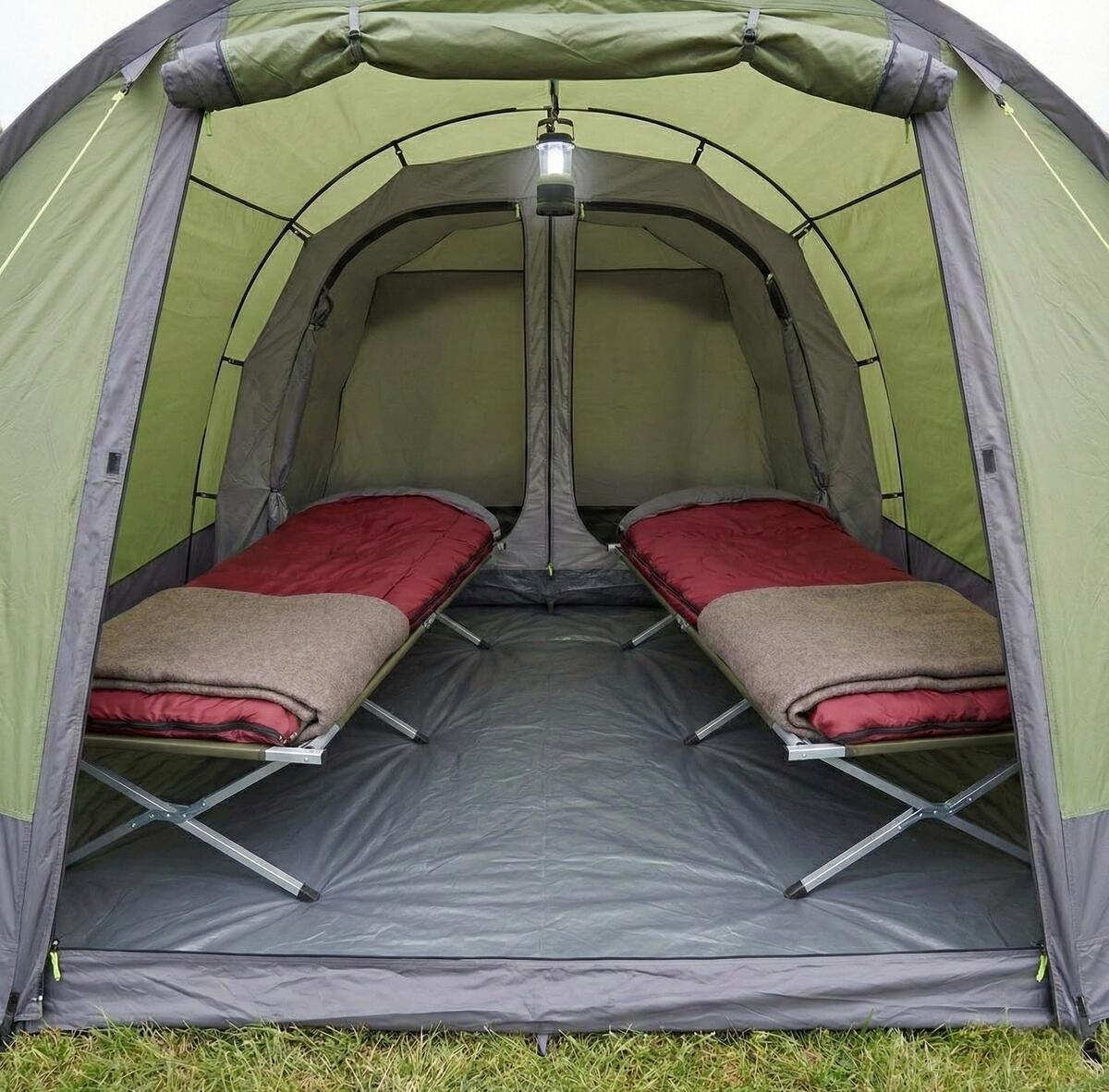 Interior of a pre-pitched camping tent showing practical layout